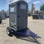 portable toilet trailer in yard